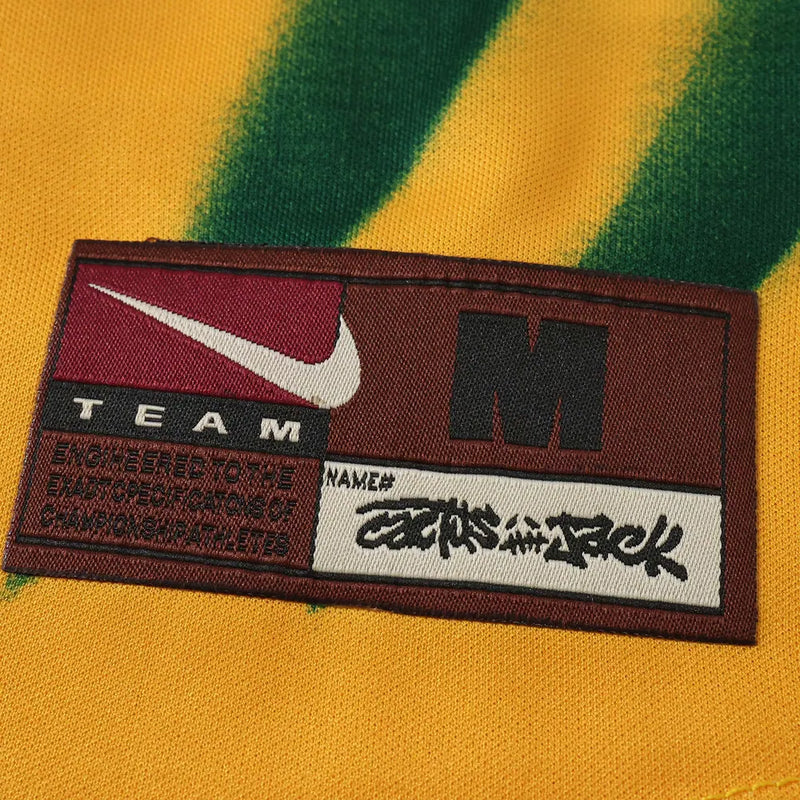 Camisa Brasil Cactus Jack x Travis Scott 2026 Total 90 - etiqueta Nike Team Cactus Jack